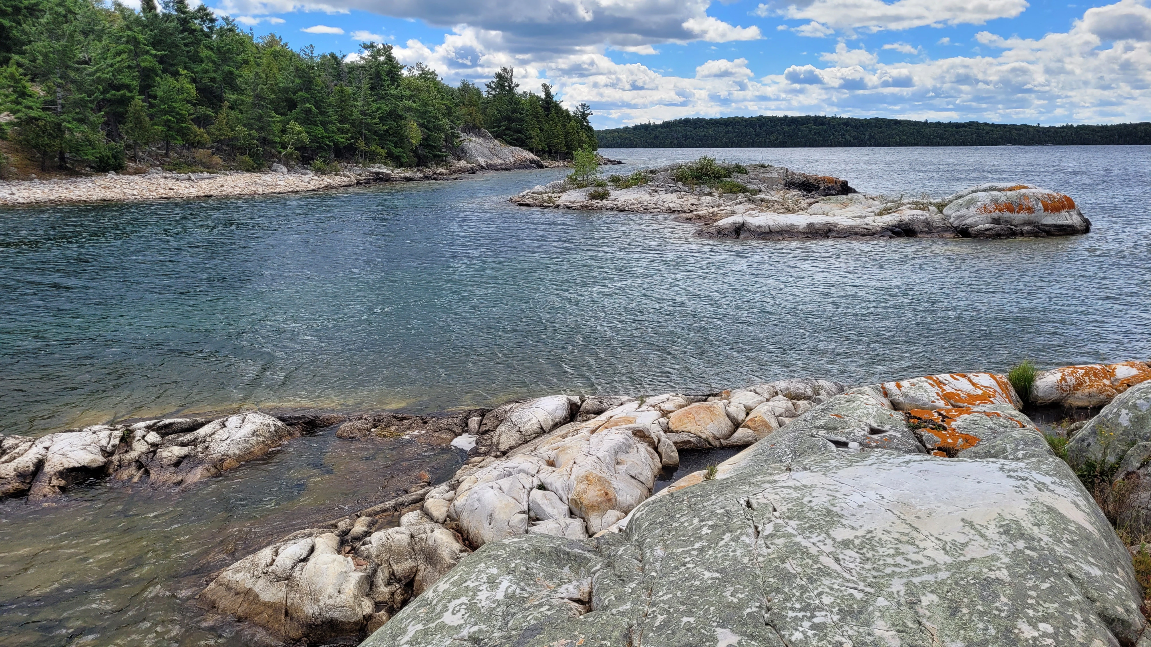 Smooth granite rocks from glacial erosion on Martins Island in the thirty thousand islands archipelago of the georgian bay